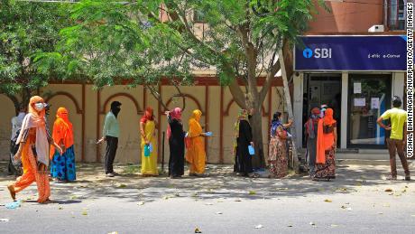 People are waiting in front of the bank during the closing in Jaipur, Rajasthan, India, on April 9th.