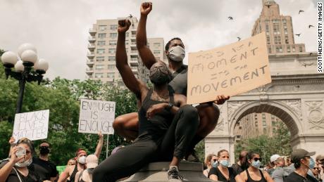 Protesters wear masks as they condemn the systematic racism and police killings of black Americans in Washington Square Park in Manhattan, on June 6, 2020 in New York City.