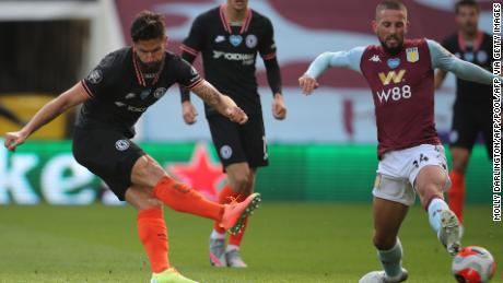 Chelsea French striker Olivier Giroud scores his team’s winning goal as his shot deflects off the chest of challenging Conor Hourihane’s boots to beat Orjan Nyland in an Aston Villa goal. 