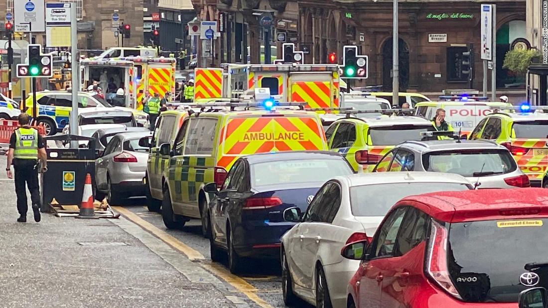 Police descend into downtown Glasgow after a police officer is stabbed