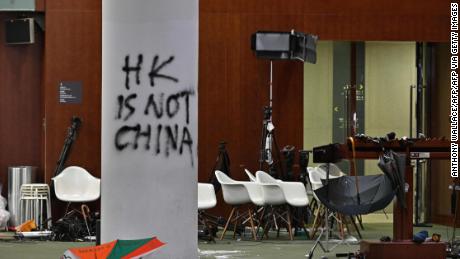 Graffiti and umbrellas were seen in front of the main chamber of the Legislative Council during a media tour of Hong Kong on July 3, 2019, two days after protesters broke into the complex.