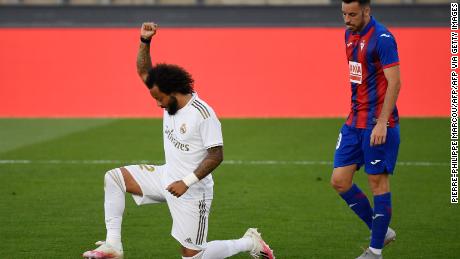 Marcelo knelt on one knee and raised his fist in solidarity with the Black Lives Matter movement after scoring Real's third goal.