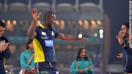 Sammy dances with teammates on stage before the start of the last cricket match of the Pakistani Super League.