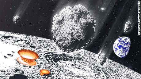 This artist&#39;s illustration shows an asteroid shower on the moon and Earth.