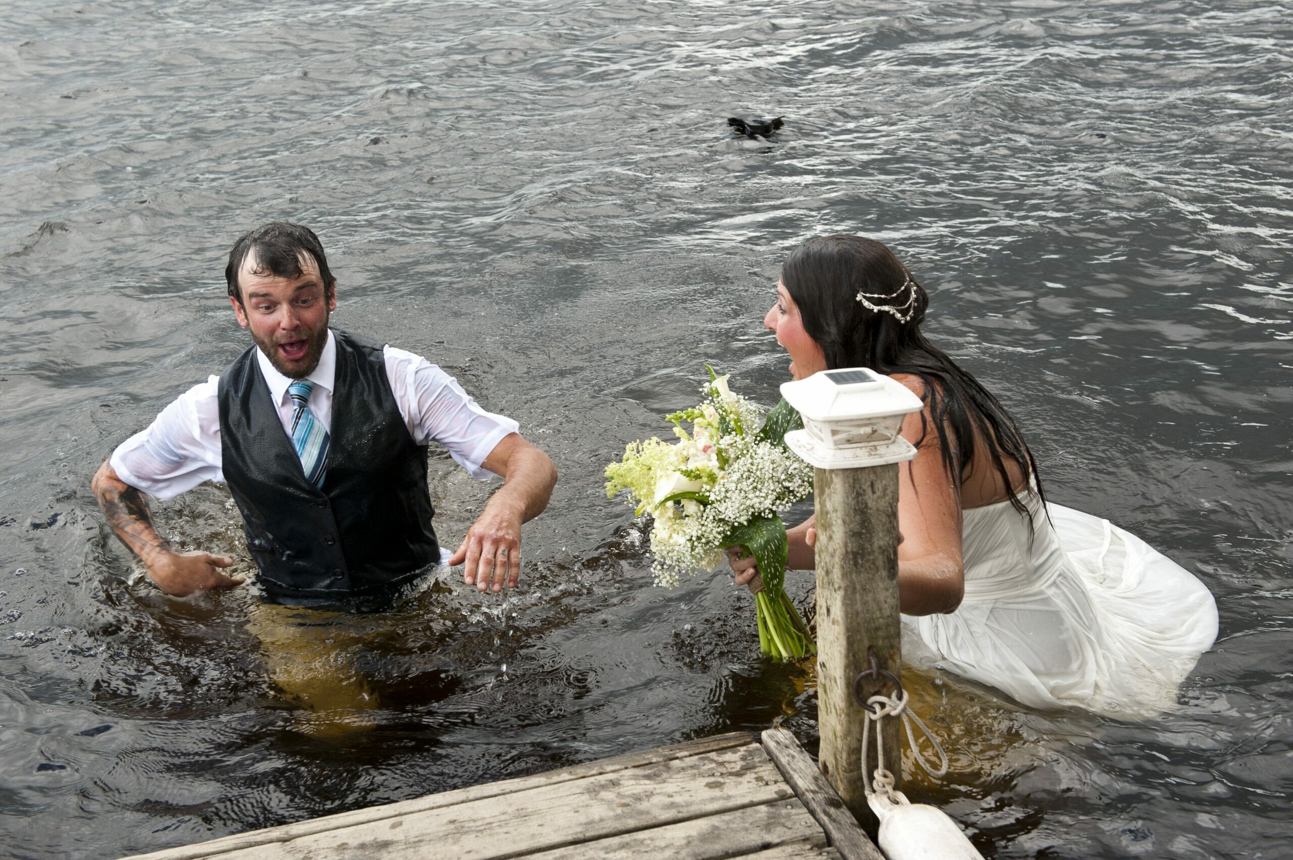 Bride, groom fall into river during wedding photos while attempting 'romantic' dance move