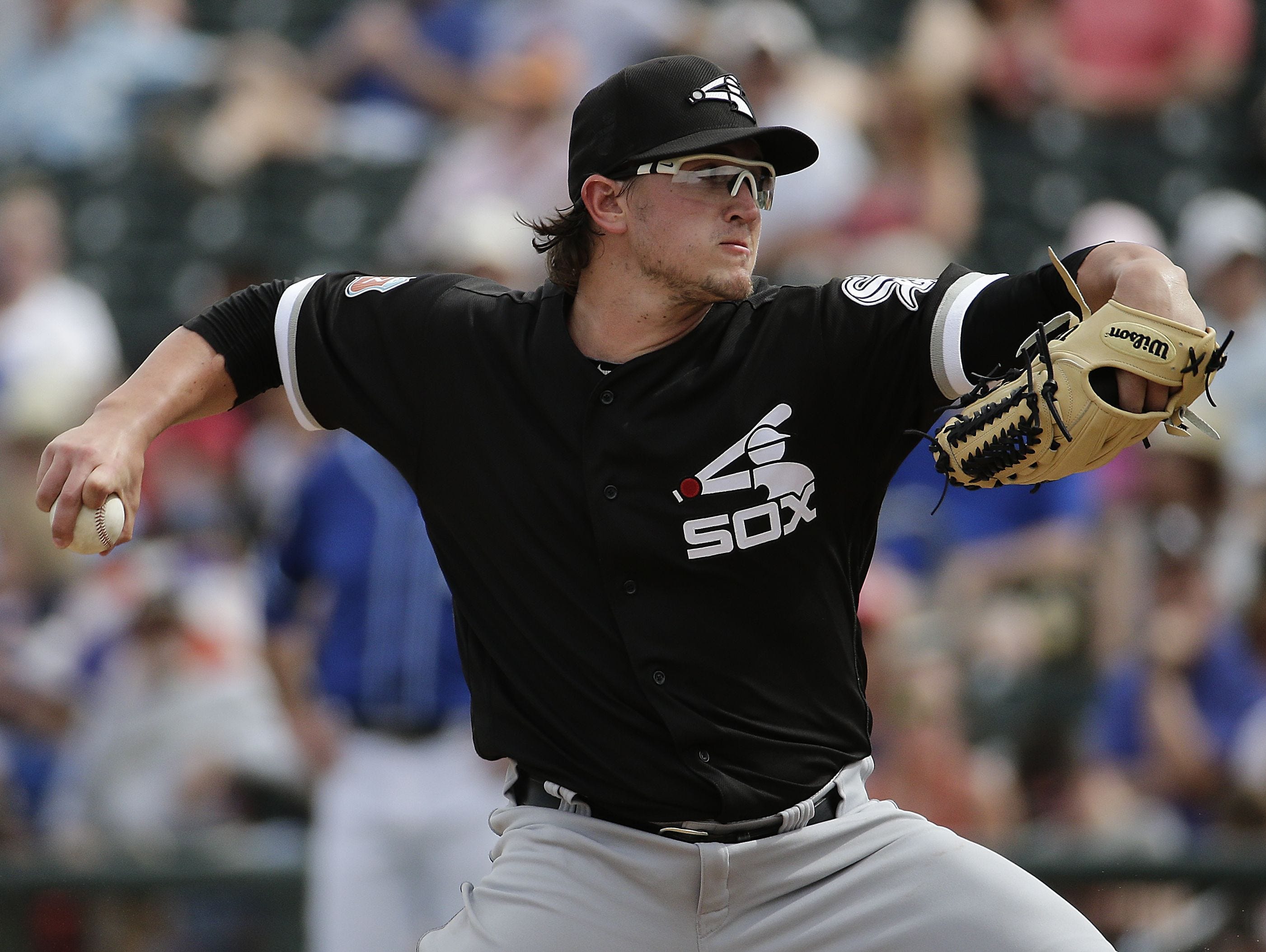 The Chicago White Sox's Carson Fulmer throws during the third inning of a spring training baseball game against the Kansas City Royals on March 5, 2016.