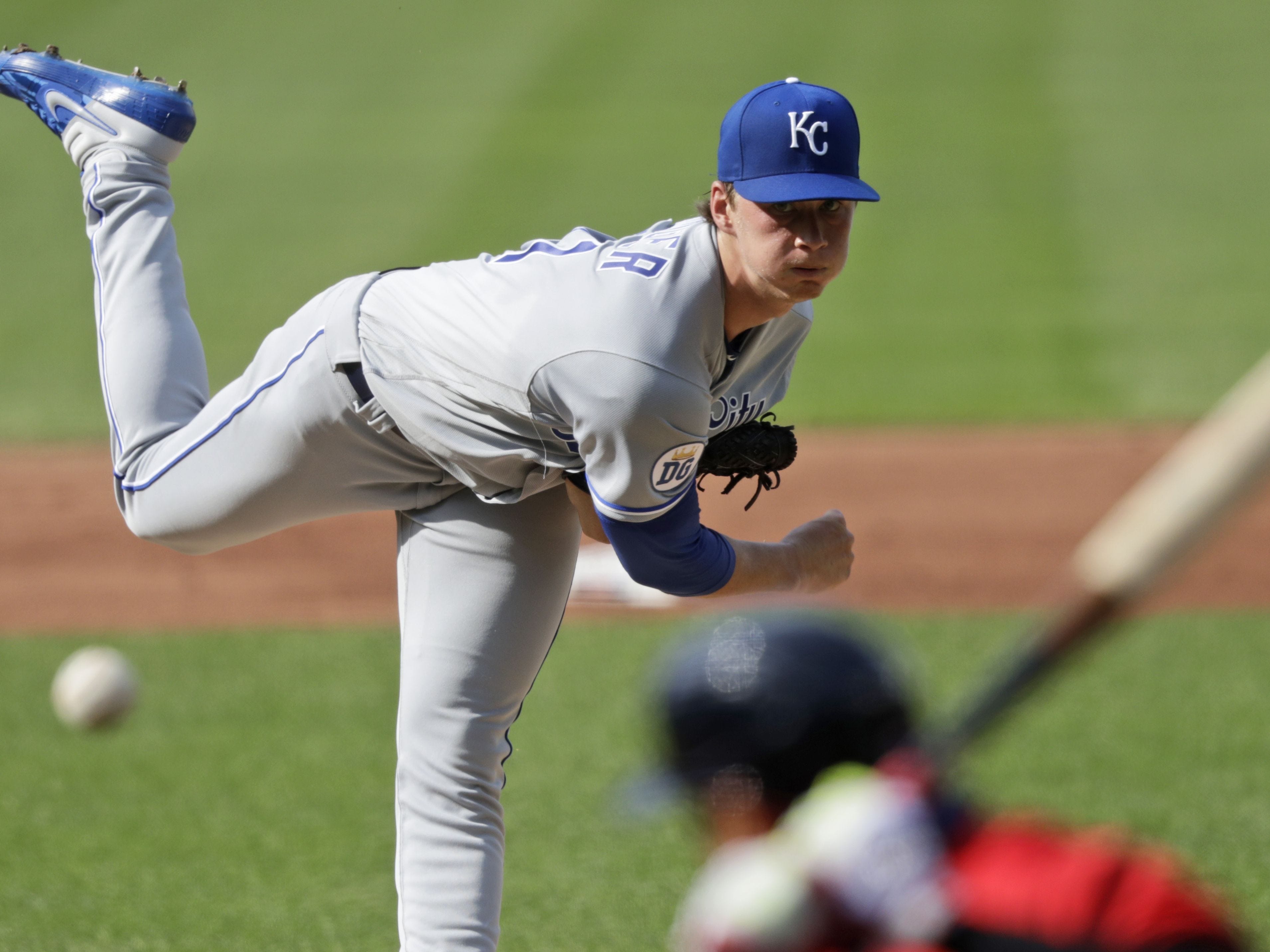 Kansas City Royals starting pitcher Brady Singer delivers to Cleveland Indians' Cesar Hernandez in the first inning in a baseball game Saturday, July 25, 2020, in Cleveland. (AP Photo/Tony Dejak)