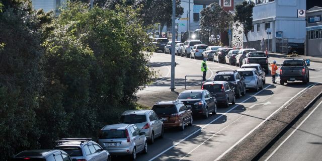 Cars line up outside a COVID-19 testing center in Auckland, New Zealand, on Thursday. (AP)