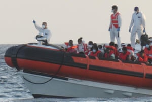 The patrol boat of the Italian Coast Guard is loaded with rescued migrants on its way to desembark at the port in Lampedusa, Italy, on 30 August 2020.