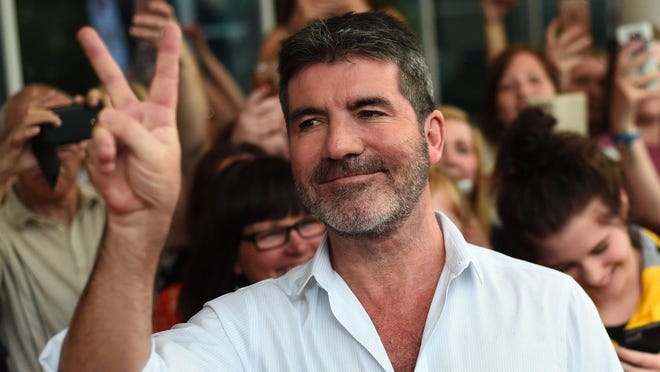 Simon Cowell is recuperating after breaking his back in a tumble off an electric bicycle.