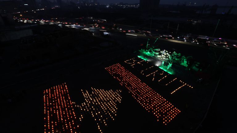Paper lanterns in the shape of a Lebanese flag mark the one-month anniversary of the city's fatal explosion