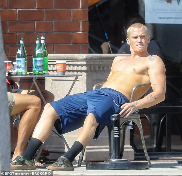 Soaked in the sun: shirtless Cody went on a low-key outing, showcasing his matching physique and ink