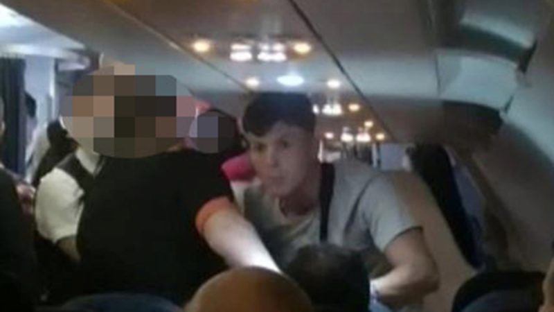 A video of a plane passenger punching a woman in an alleged racist attack

