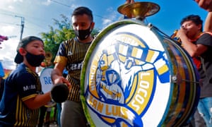 Atletico de San Luis fans play the drum as they cheer for their team ahead of the Mexican Aperturna Championship soccer match against Monterrey, outside the Alfonso Estras stadium in San Luis Potosi, Mexico, on September 20, 2020, amid the Covid-19 coronavirus pandemic.