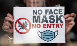 A shop window in Newport, Wales, last week, where people must wear face masks in stores and other indoor public places.