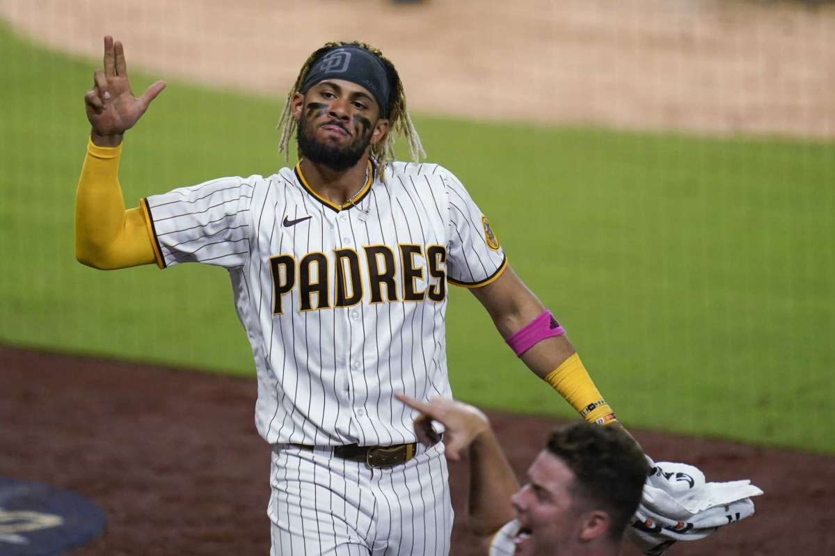 Fernando Tatis Jr. of San Diego Padres points to his teammate after being run on home by Will Myers during the seventh game of the second game of the National League Baseball Series against the St. Louis Cardinals, Thursday October 1, 2020, in San Diego.