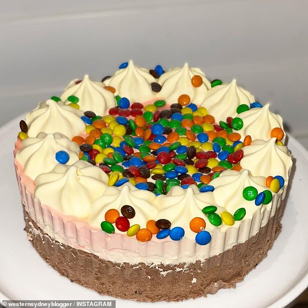 The $ 15 cake features layers of chocolate, strawberry, and vanilla flavored ice cream with a cookie cutter base and is topped with Mini M & M's.