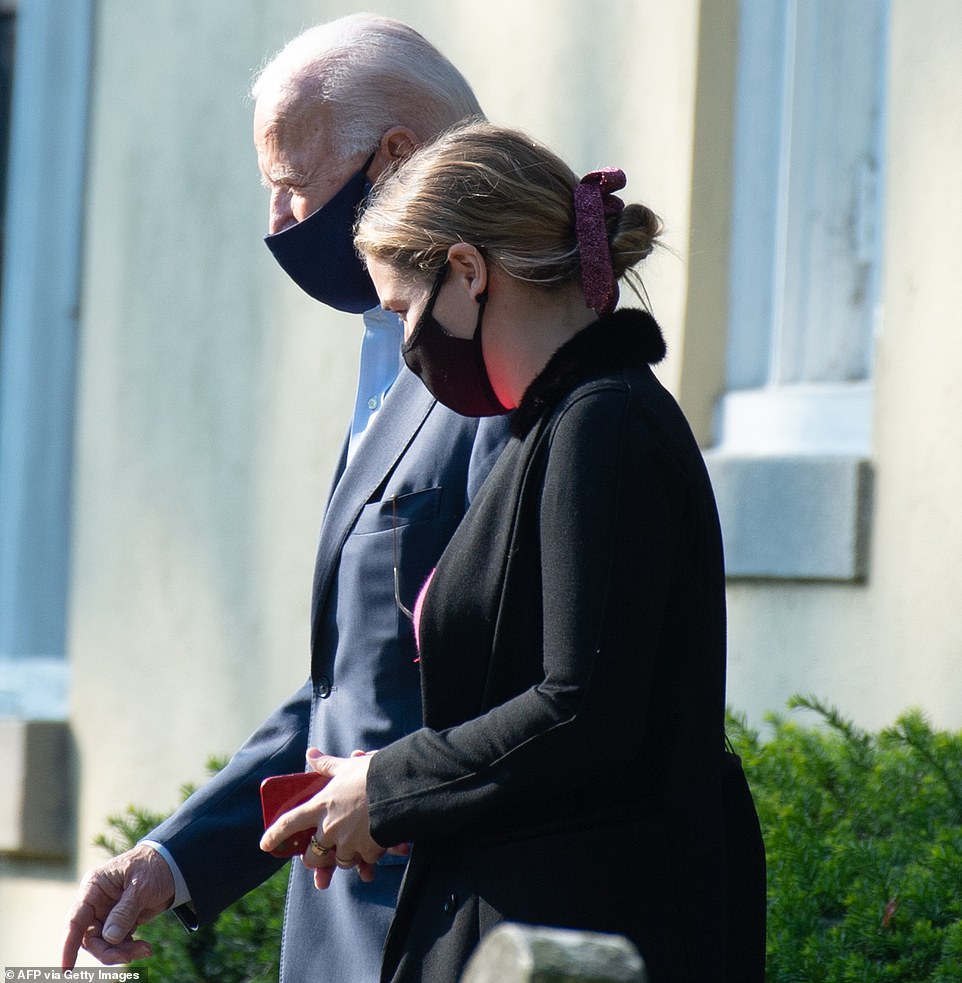 The former vice president was arrested leaving the services with his granddaughter Finnegan Biden, Hunter Biden's daughter.  Then the family visited Beau Biden's grave