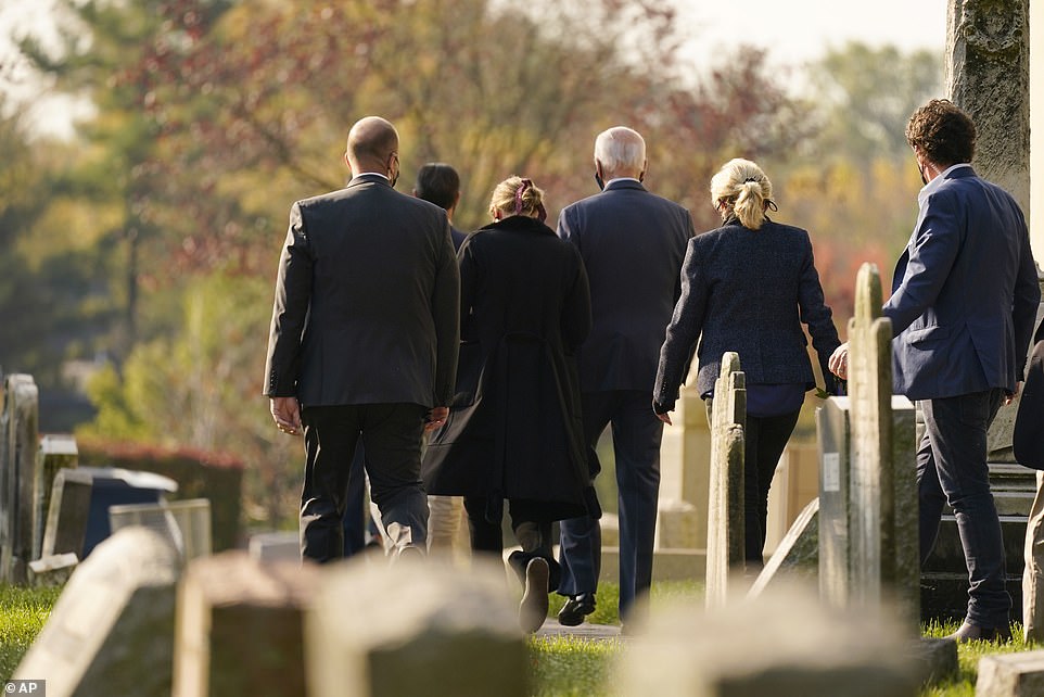 Joe Biden (center) leaves Mass with his wife Jill (second from right) and granddaughter Finnegan (second from left).  The Biden family paid their respects to Beau Biden after church services