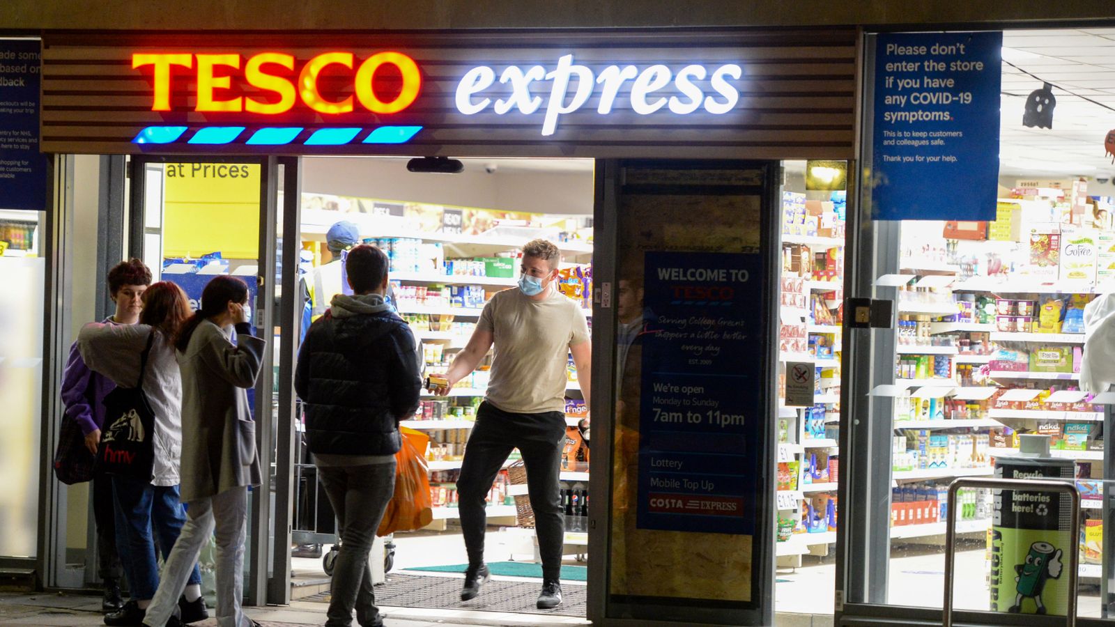 BRISTOL, ENGLAND - OCTOBER 12: People are seen at Tesco Express on October 12, 2020 in Bristol, England. Despite the coronavirus infection rate in the city jumping from 44.2 new cases per 100,000 to 95.4 in the week ending Thursday, October 8, Bristol has been graded as medium or "Tier 1" in the government's new three-tier Covid-19 alert system. Tier 1 means that the rule of six should be observed and that there is a 10 p.m. curfew on pubs and restaurants.  (Photo by Finnbarr Webster/Getty Images)