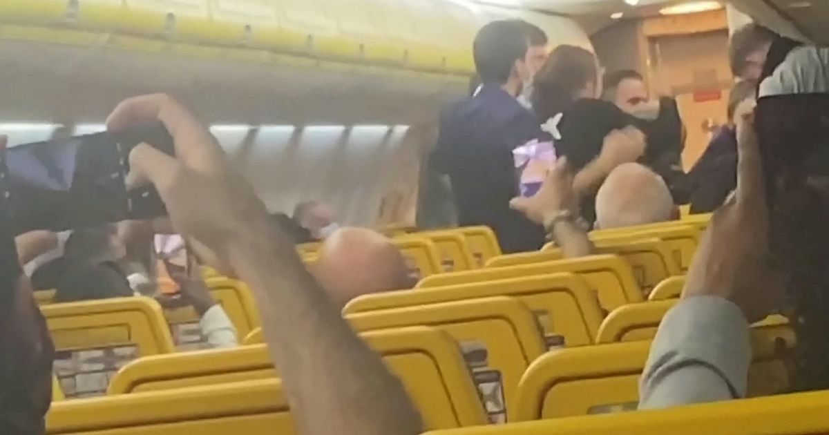 Shocking footage shows a massive fighting erupting between passengers on board a Ryanair flight bound for Manchester