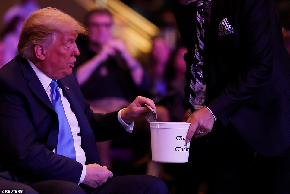 Silly Trump puts a large amount of cash in a collection box at the church in Las Vegas