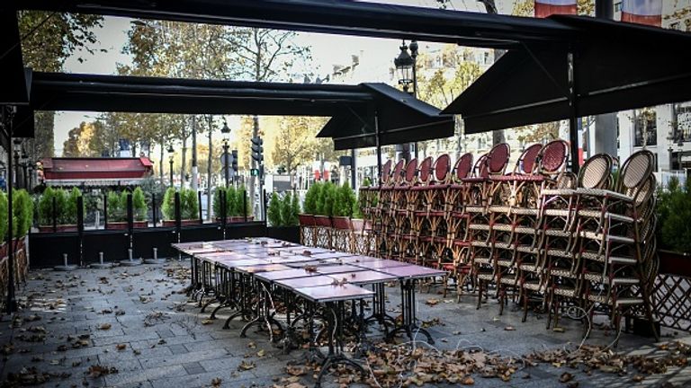 The Champs Elysees is largely deserted as restaurants and cafes around the country have closed