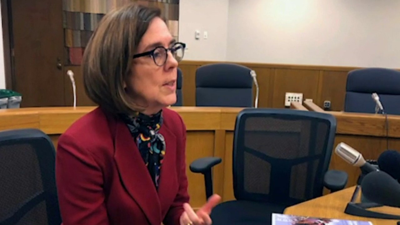 The Oregon governor tells residents to call police on people violating COVID restrictions