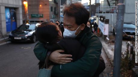 A father embraces his daughter while she passes the college entrance examination amid the Coronavirus pandemic on December 3, 2020 in Seoul, South Korea. 
