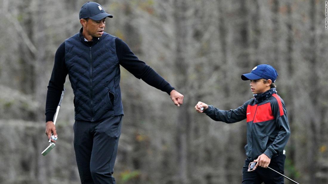 Tiger Woods is doing a warm-up with his 11-year-old son Charlie, and the similarities are stunning

