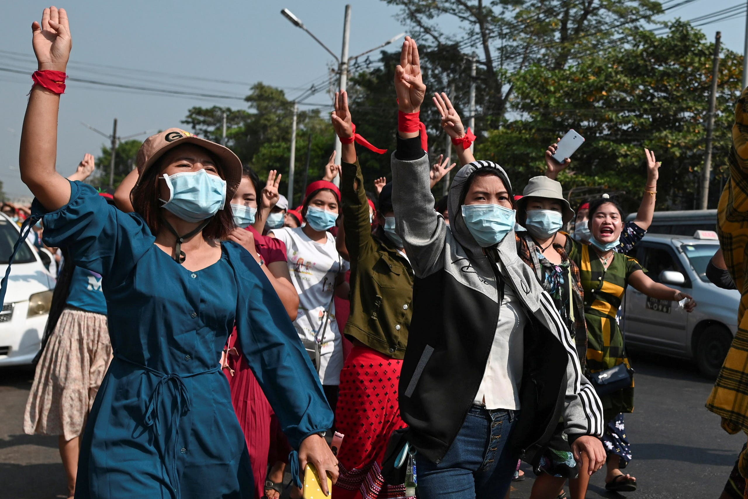 People protest in a street against the military coup in Myanmar 