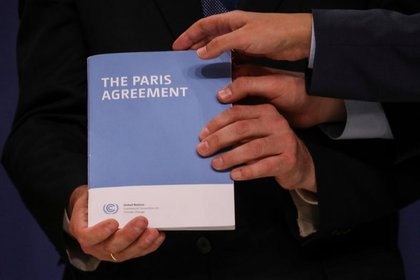 A copy of the Paris Agreement during the United Nations Climate Change Conference (COP25) in Madrid, Spain, on December 13, 2019 (Reuters)