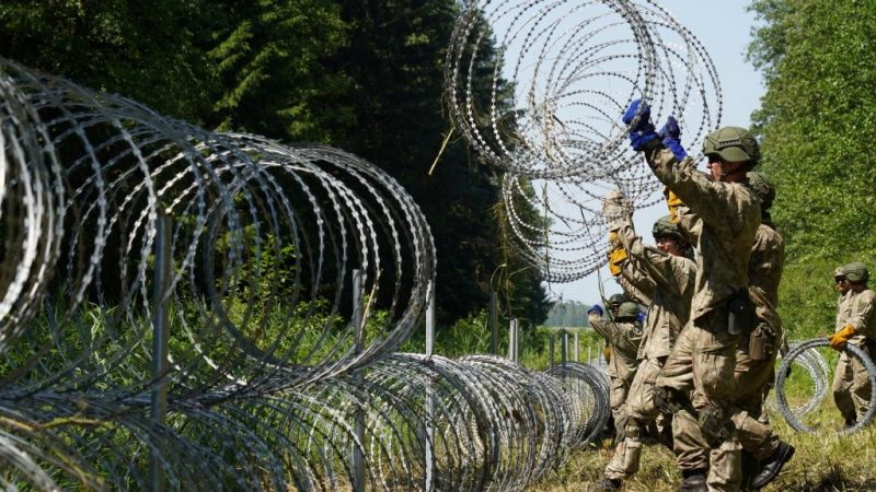 Vilnius says Belarusian border guards have breached the border and pushed migrants into Lithuania

