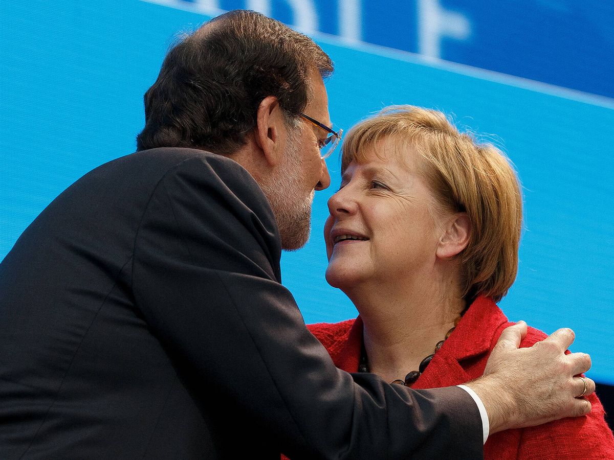 Photo: German Chancellor Angela Merkel, with then-Prime Minister of Spain, Mariano Rajoy, at the EPP conference in Madrid.  (GT)