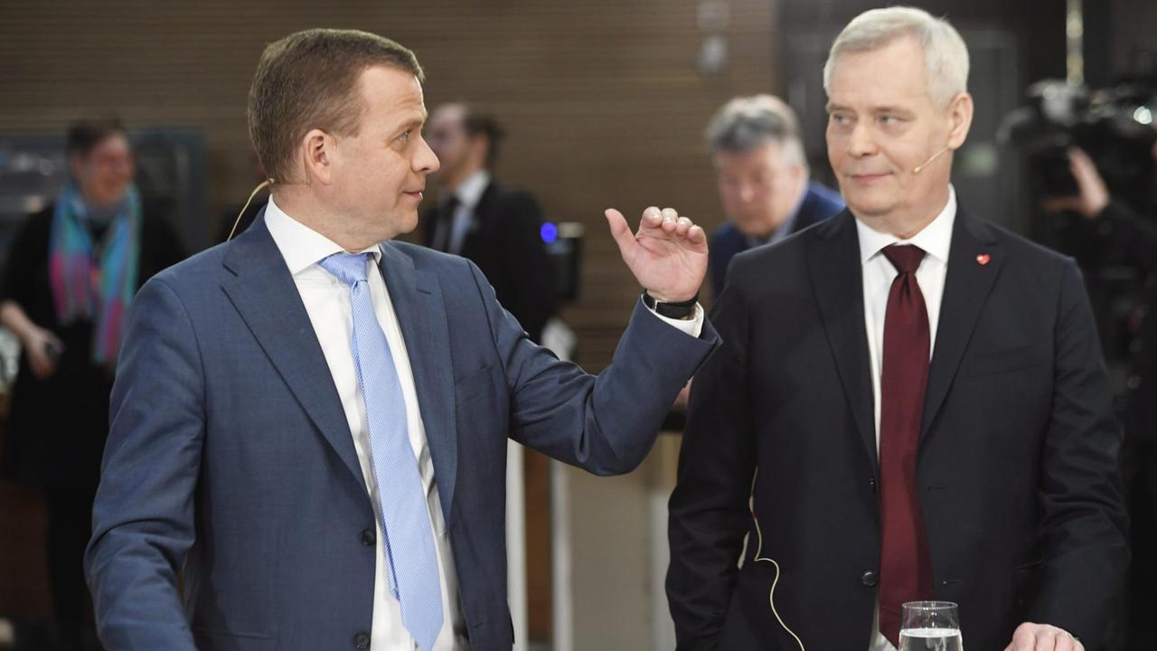 National Rally party leader Petteri Orpo (left) and Social Democrats president, Antti Rinne, at a televised debate after Finland's parliamentary elections.
