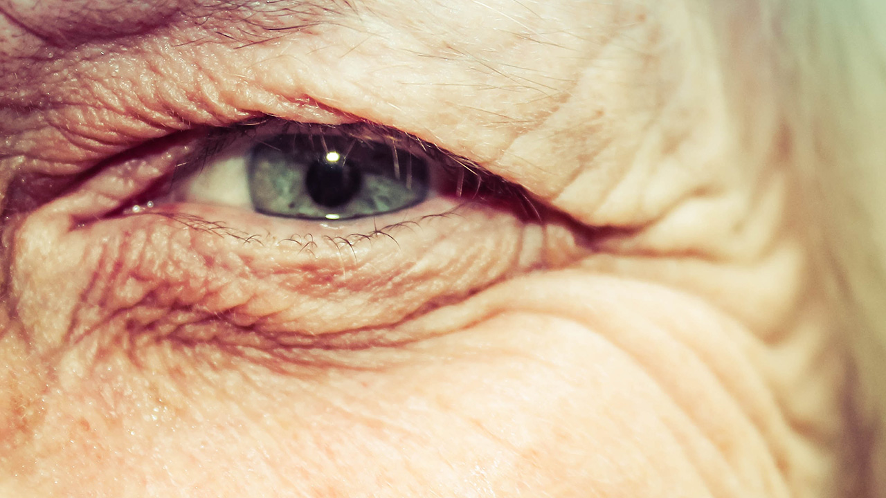An elderly woman receives the first chip in her eye in the UK