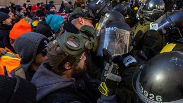 Protesters wear protective masks
