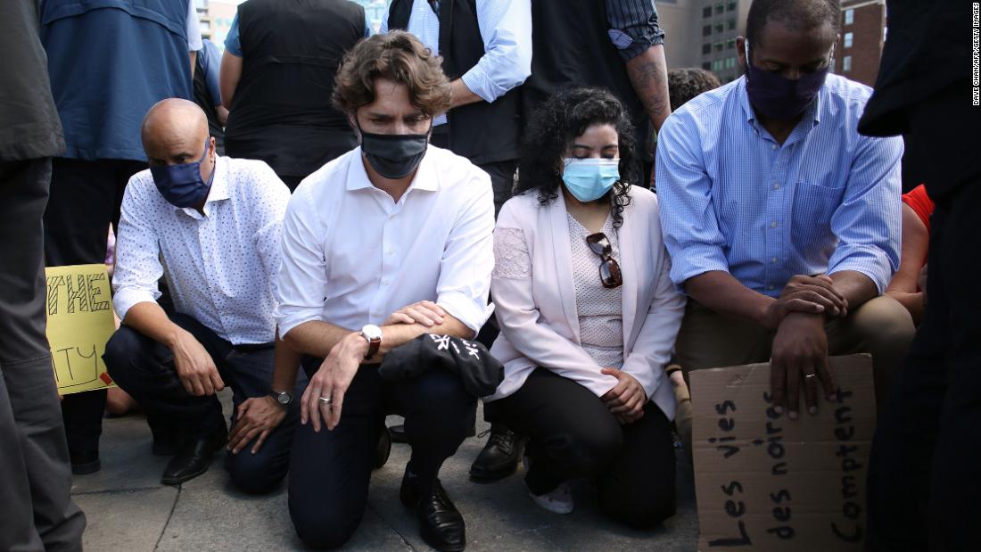 Justin Trudeau kneels at the Black Lives Matter demonstration on Parliament Hill