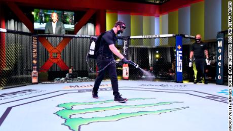 Workers are renovating the octagon in UFC APEX, the UFC arena. 