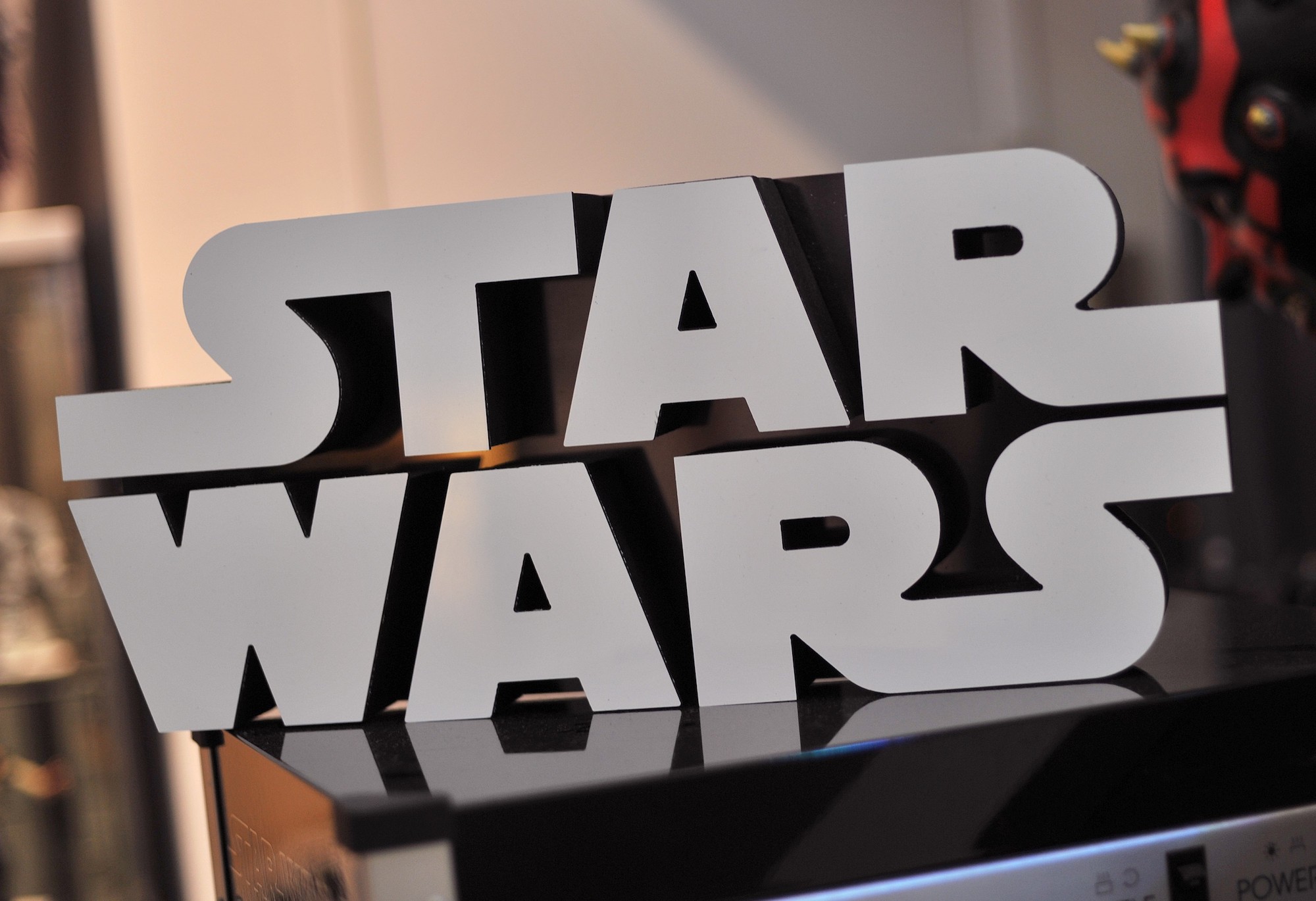 A Star Wars logo sign inside Rancho Obi-Wan, the world