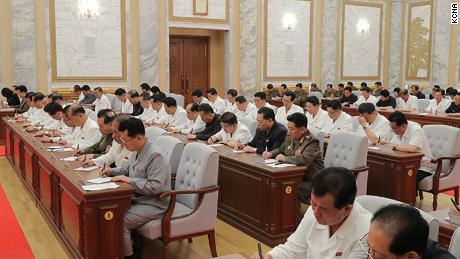 North Korean leader Kim Jong Un was seen at a meeting on Thursday in this photo provided by KCNA. Officials do not appear to wear masks or practice social distancing.