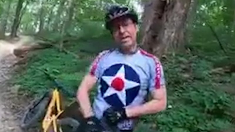 A disabled man is reprimanded by a cyclist for using a motorbike on the Park Trail

