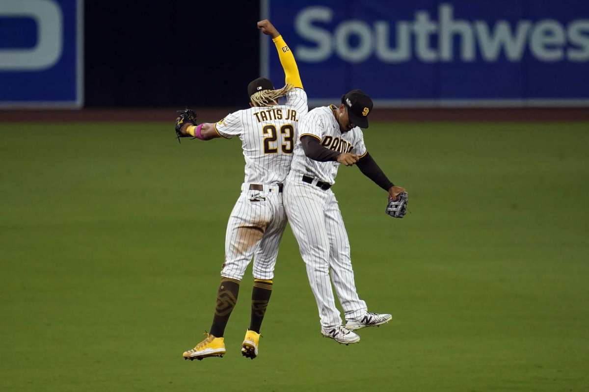 San Diego Padres Shortstop Fernando Tates Jr., left, celebrates right-hand player Trent Grisham after he defeated Padres St. Louis Cardinals 11-9 in Match 2 of the National League Baseball Series on Thursday, October 1, 2020, in San Diego.
