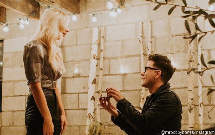 Bobby Bones feels “luckiest” after getting engaged to girlfriend Caitlin Parker