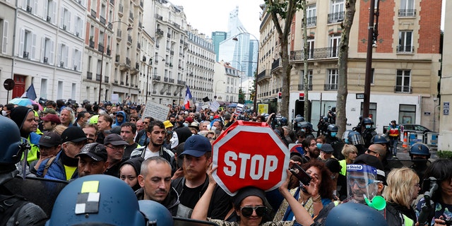 Anti-vaccination protesters gather during a demonstration in Paris, France on Saturday, August 7, 2021.