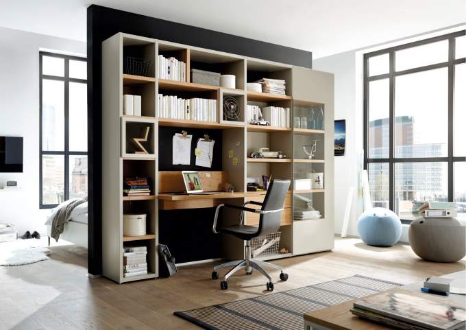 Shelf with several partitions in a one-room apartment.
