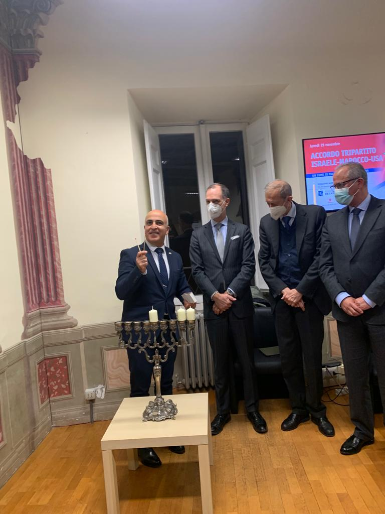 The ambassadors of Israel and Morocco light Hanukkah candles together